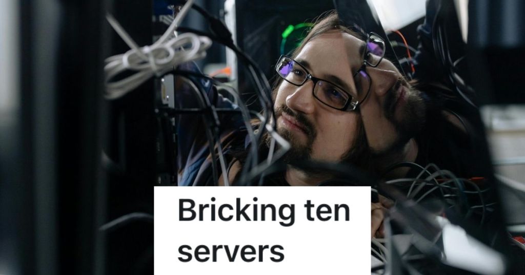 Man smiling looking at wires for a server