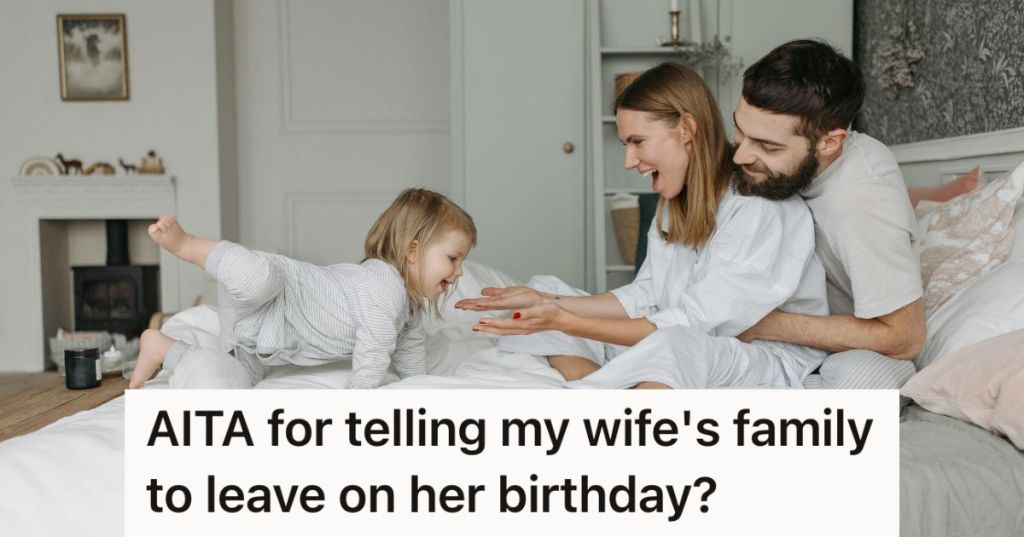 Mom, dad, and toddler playing in bed