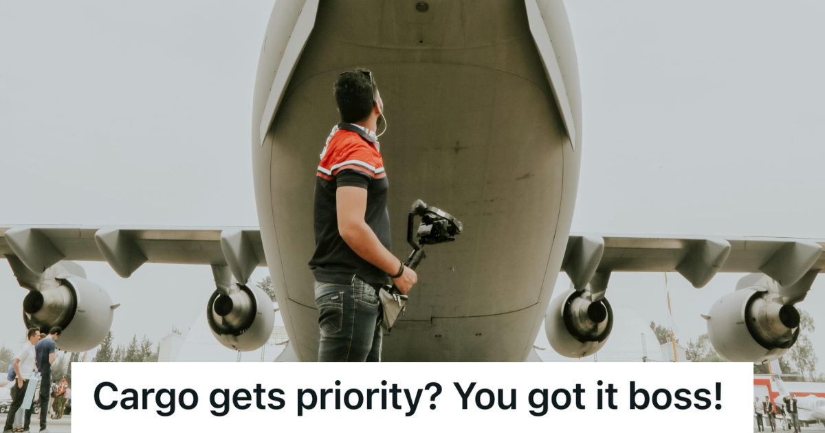 airport employee standing in front of plane