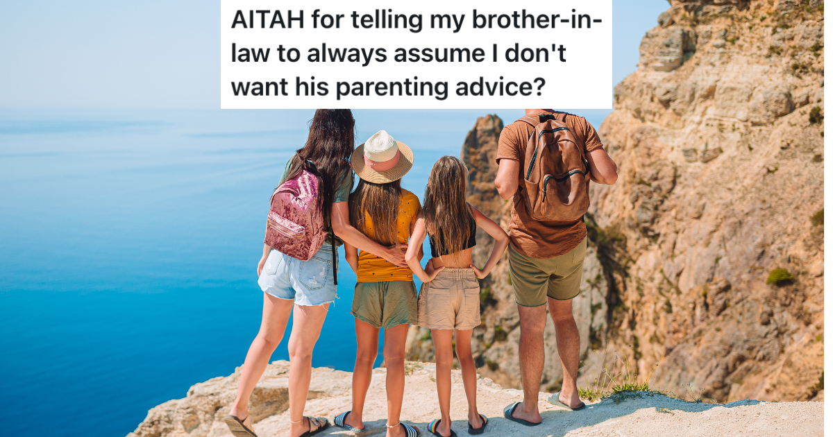 Family standing on cliff looking over ocean.