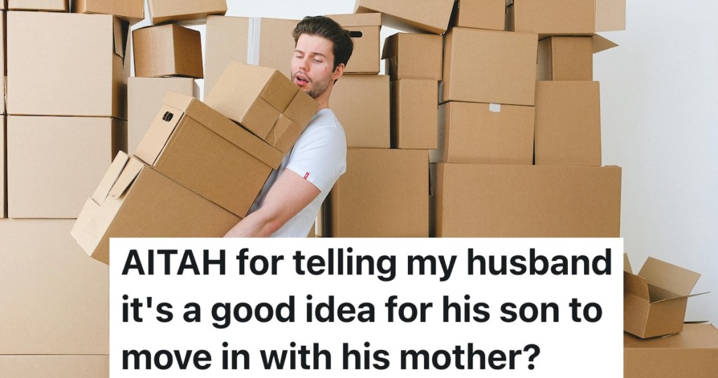 person carrying a stack of moving boxes