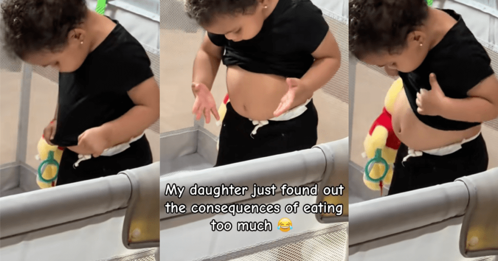 girl looking at her stomach