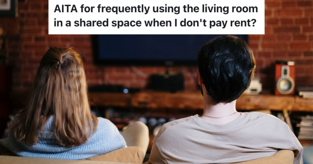 couple facing tv on couch.