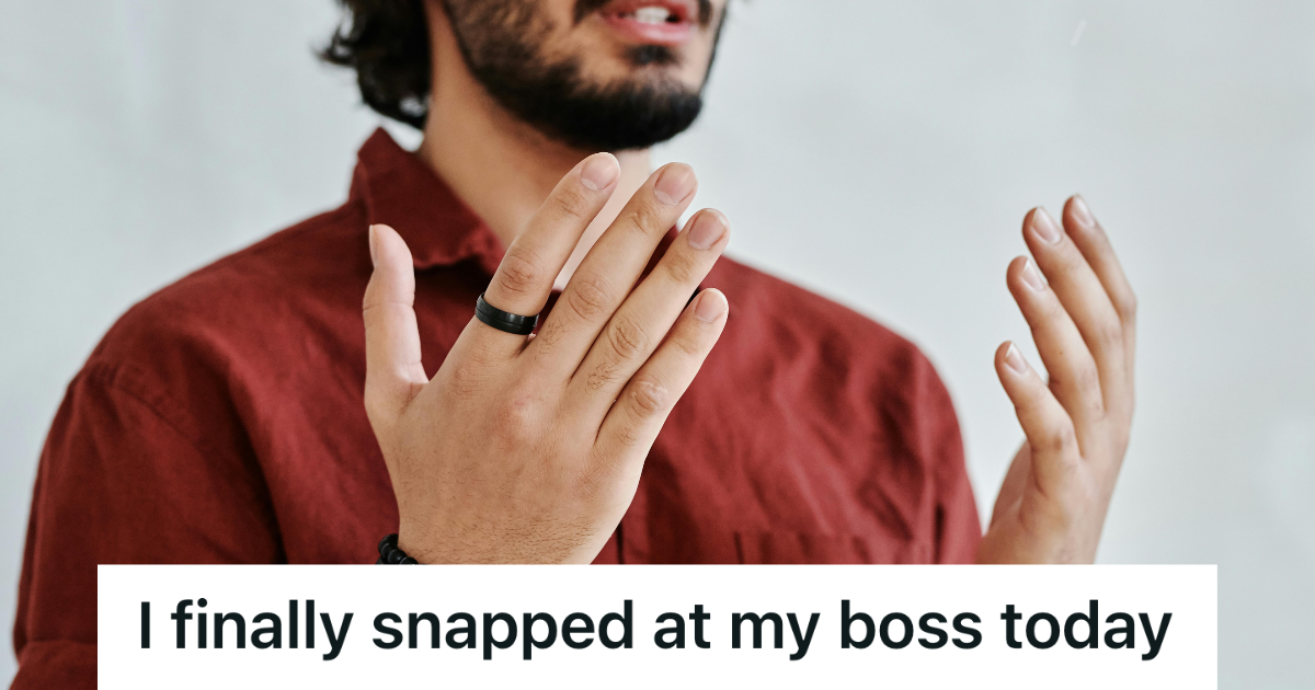 man in red putting his hands up