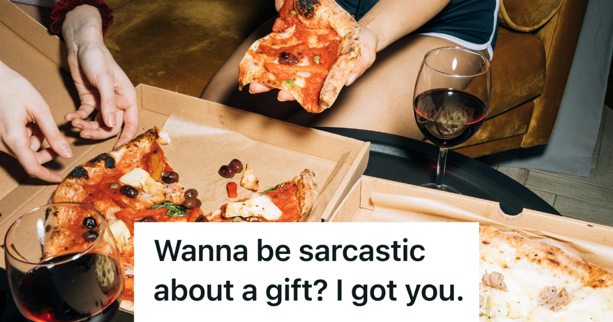 people gathering around a pizza box