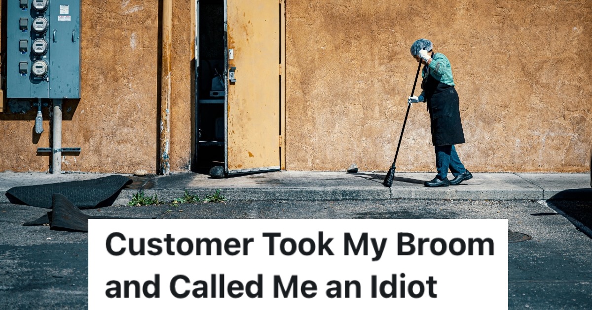 person pushing a broom at work