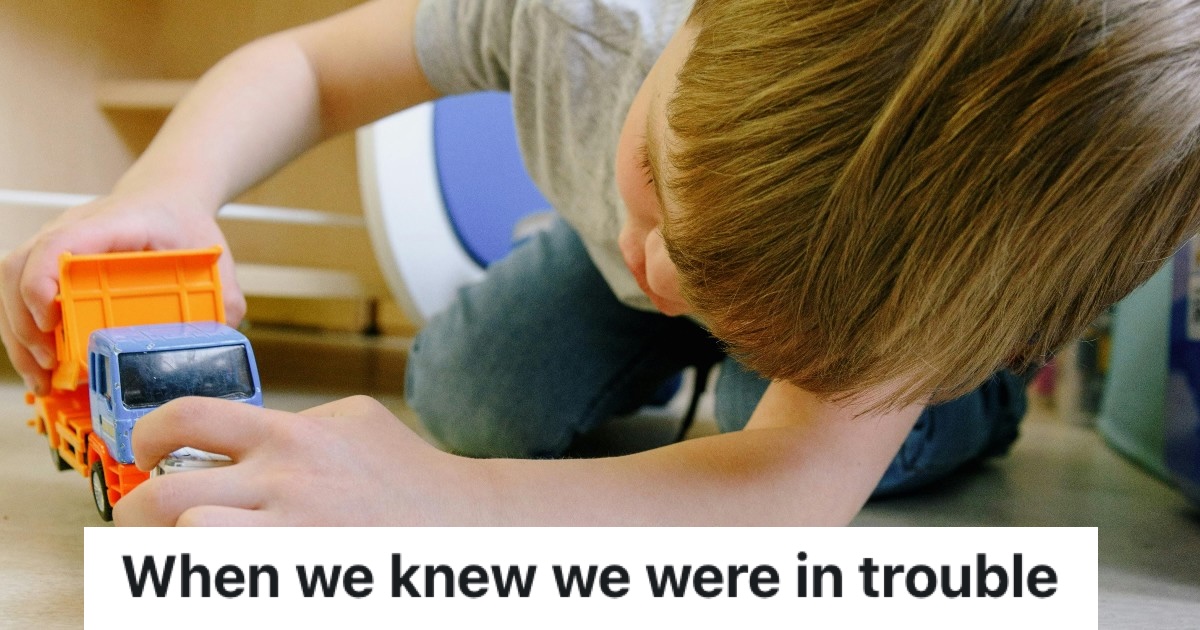 kid playing with toy truck at home