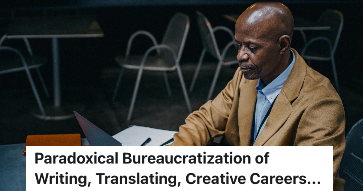 man working out science problems