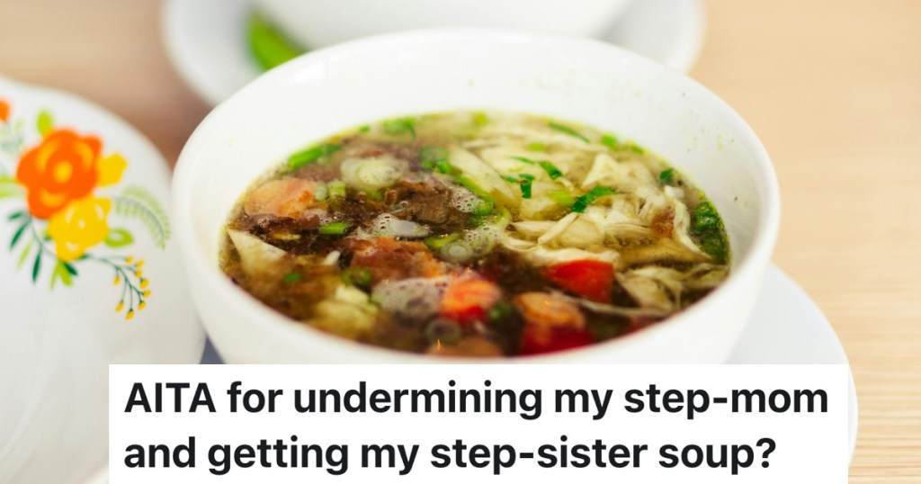 bowl of soup with carrots and noodles in it