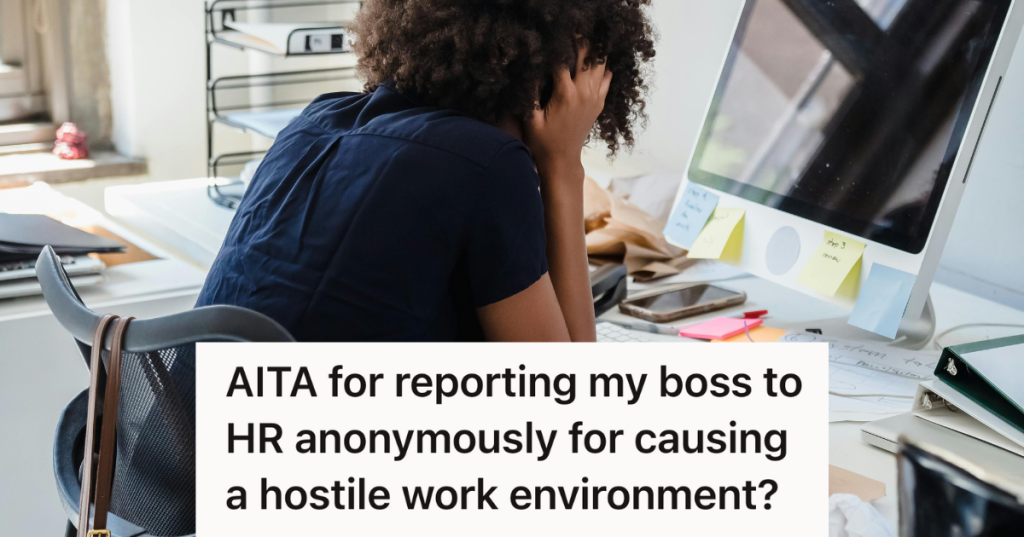 stressed woman sitting at her work computer