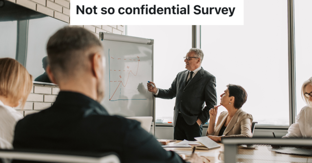 Group of people sitting in a conference room.