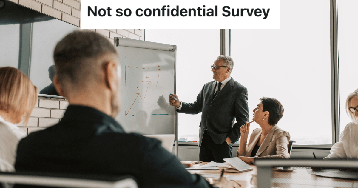 Group of people sitting in a conference room.