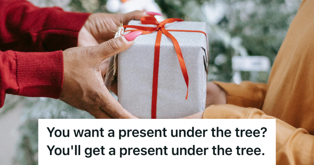two people exchanging christmas gifts