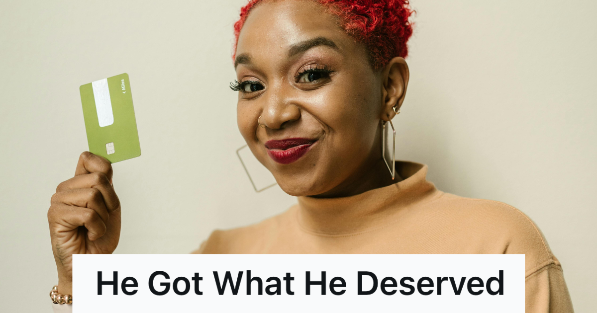 woman holding up a green credit card