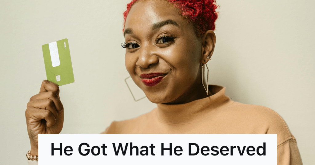 woman holding up a green credit card