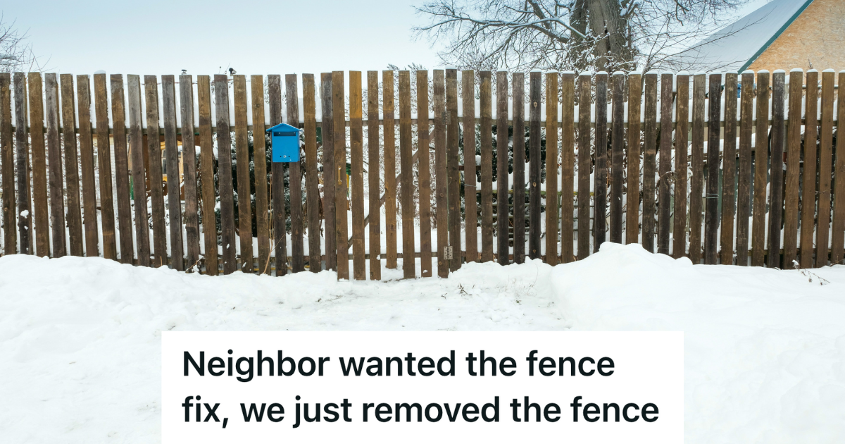 wooden fence surrounded by snow