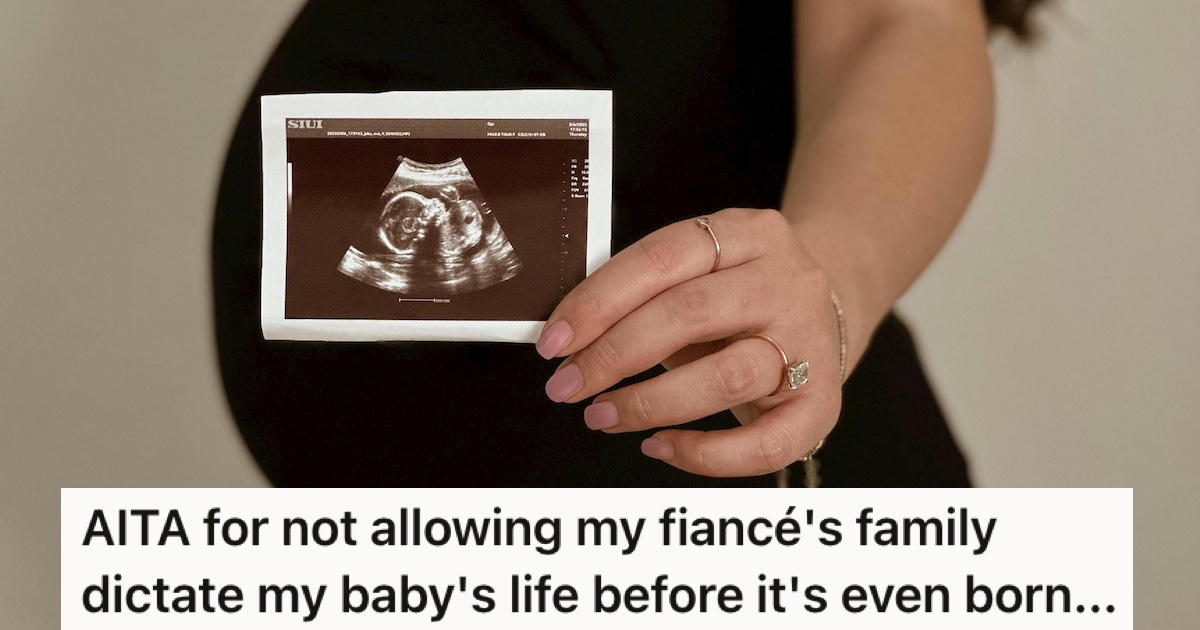 A pregnant woman holding an ultrasound