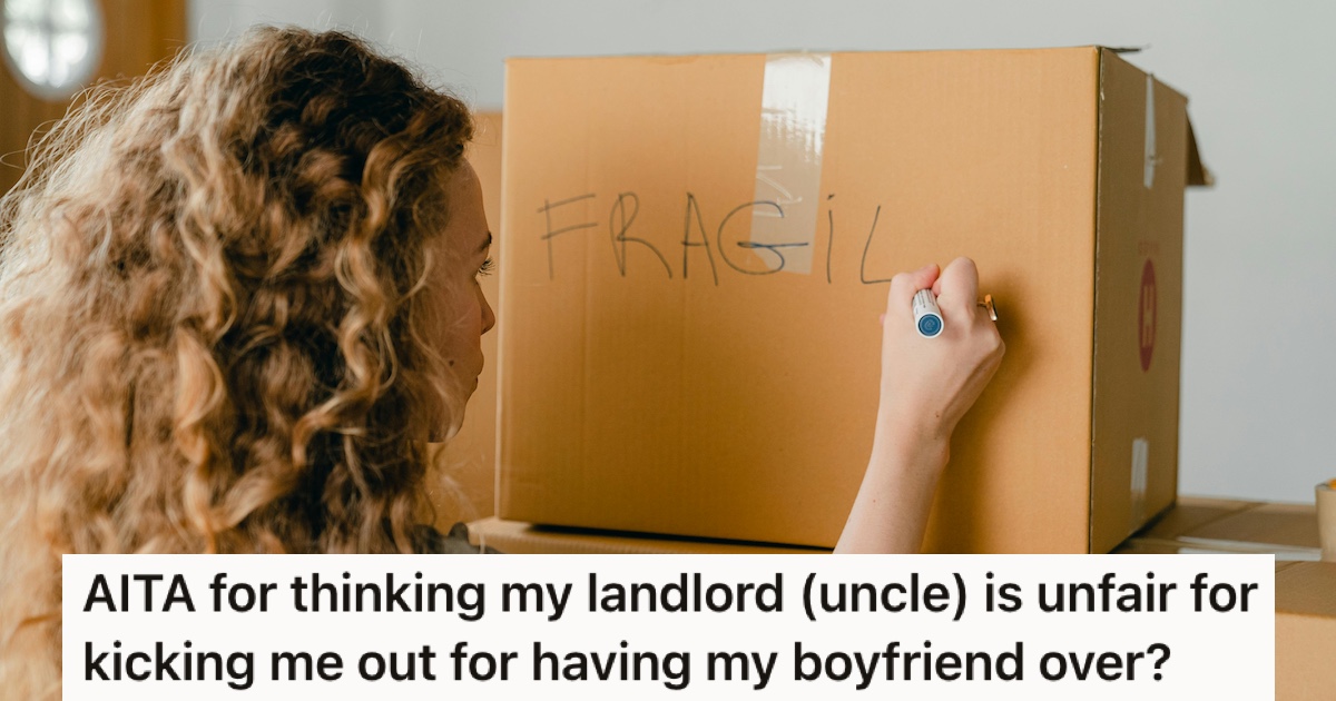 A woman labelling moving boxes
