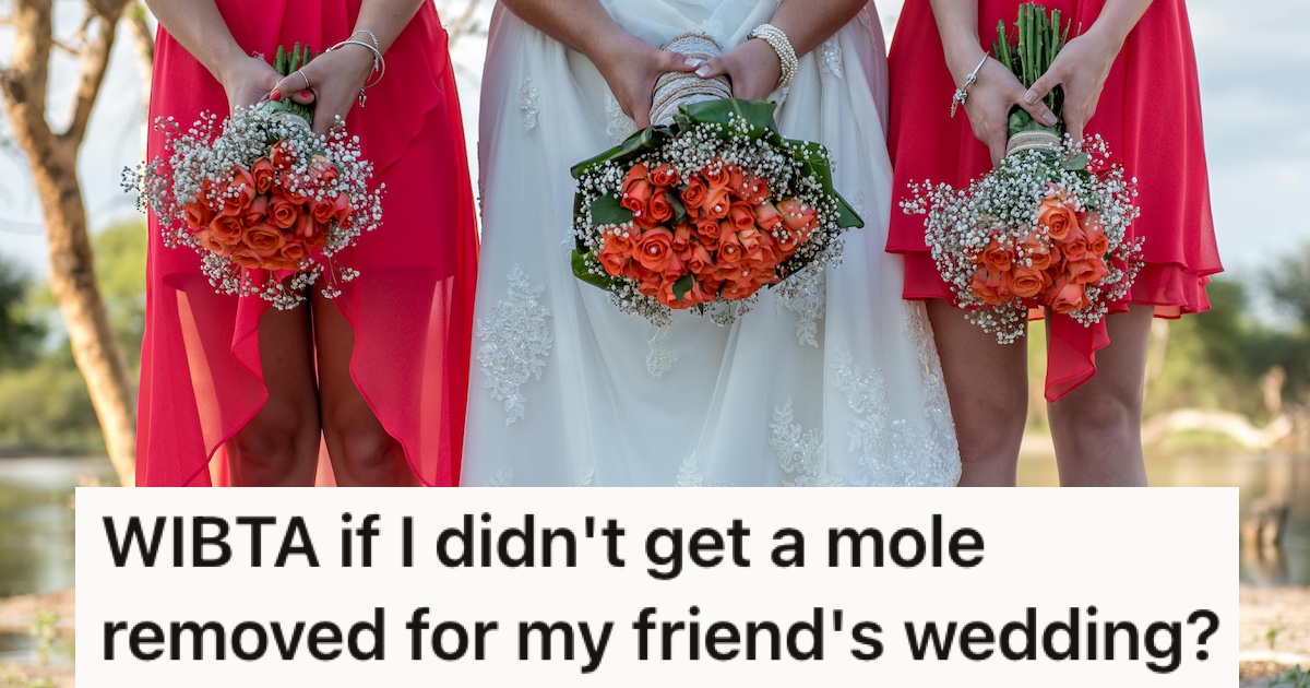 A bride and two bridesmaids holding flowers