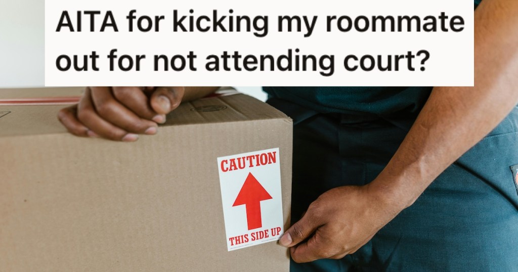 A man carrying a moving box