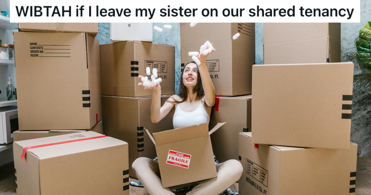 A woman catching packing peanuts amidst moving boxes