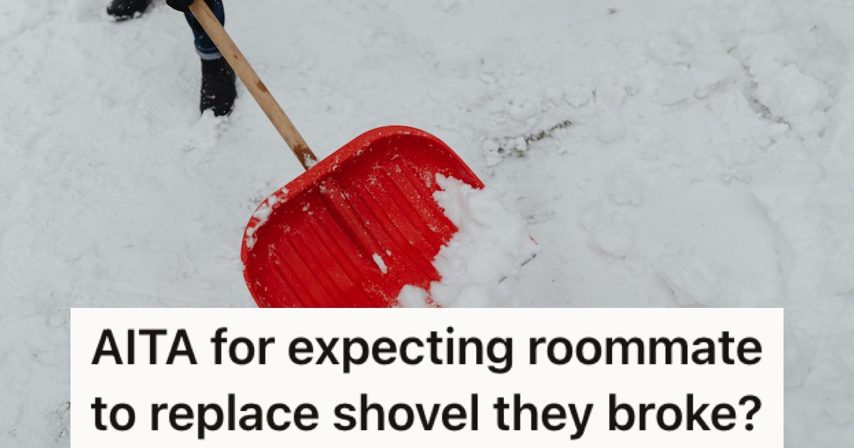 A wood and plastic snow shovel