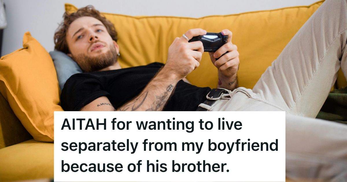 Man lying on a couch playing video games