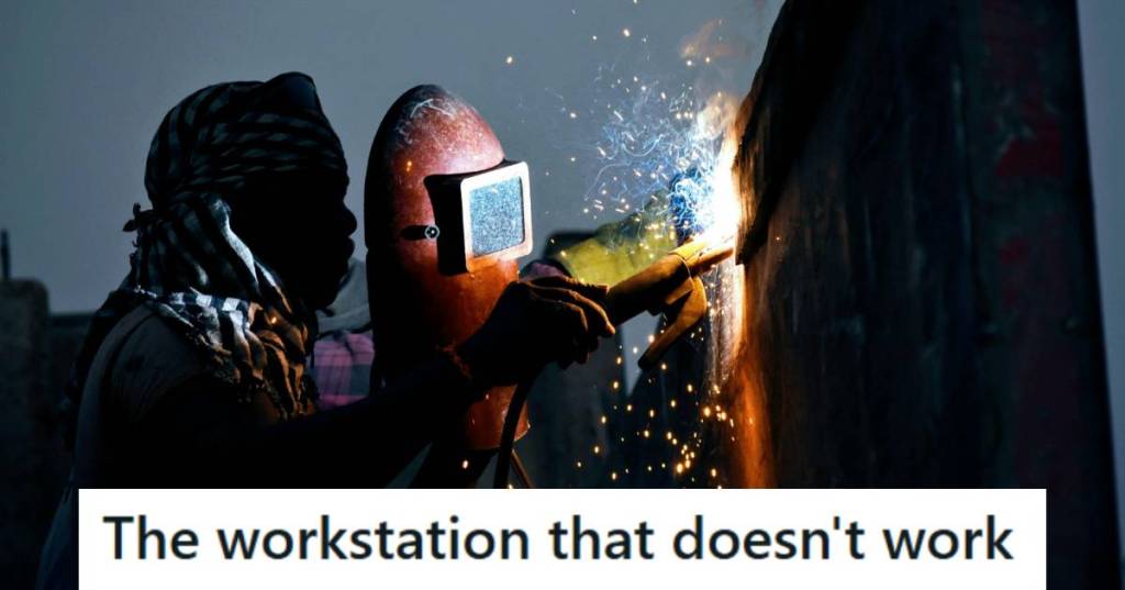 Man using a blow torch to cut through a wall