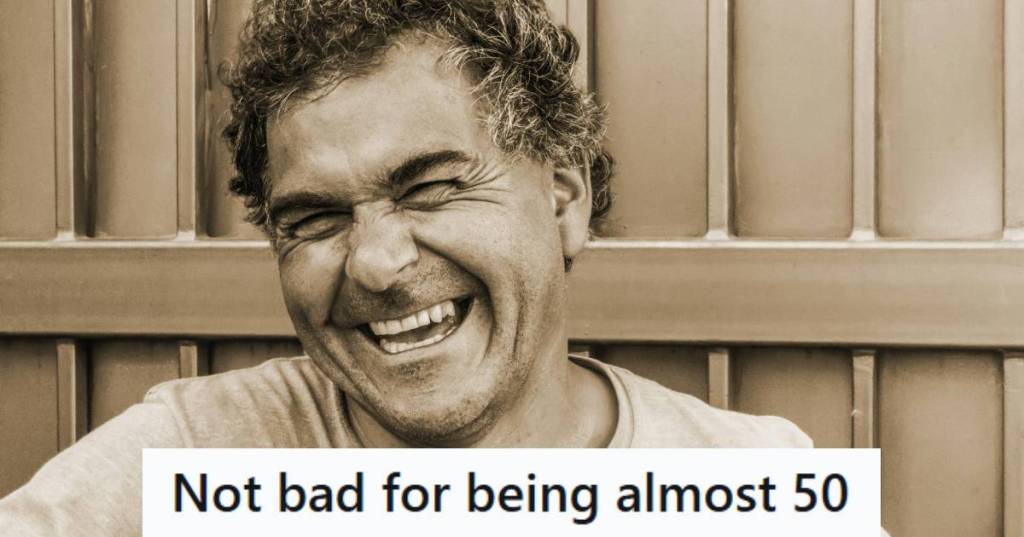 Man laughing at the comment he just made to ex wife