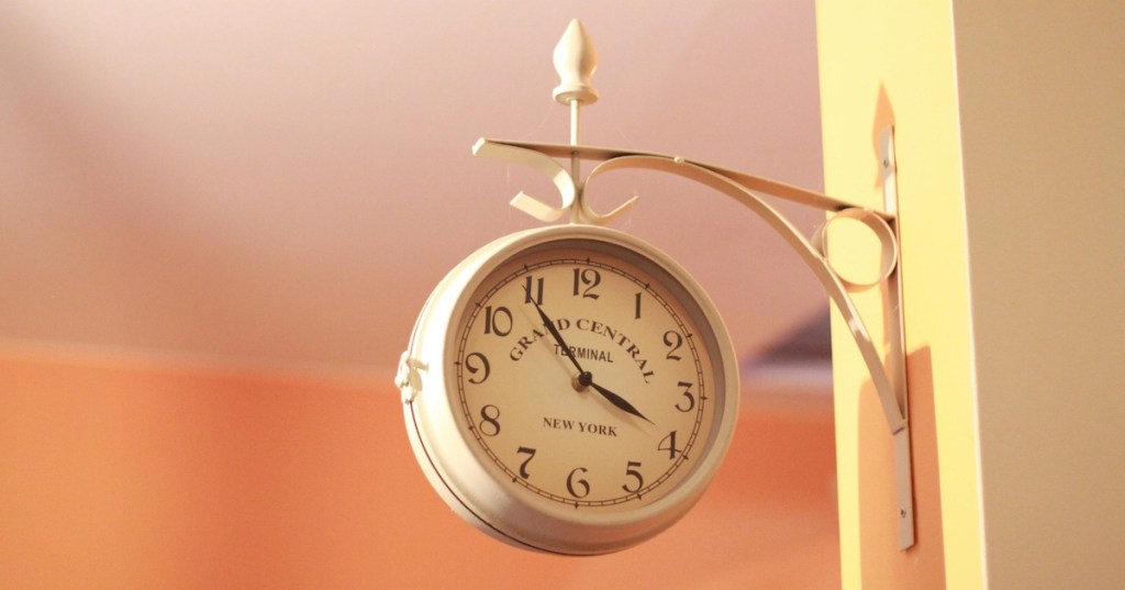 A wall-mounted station clock