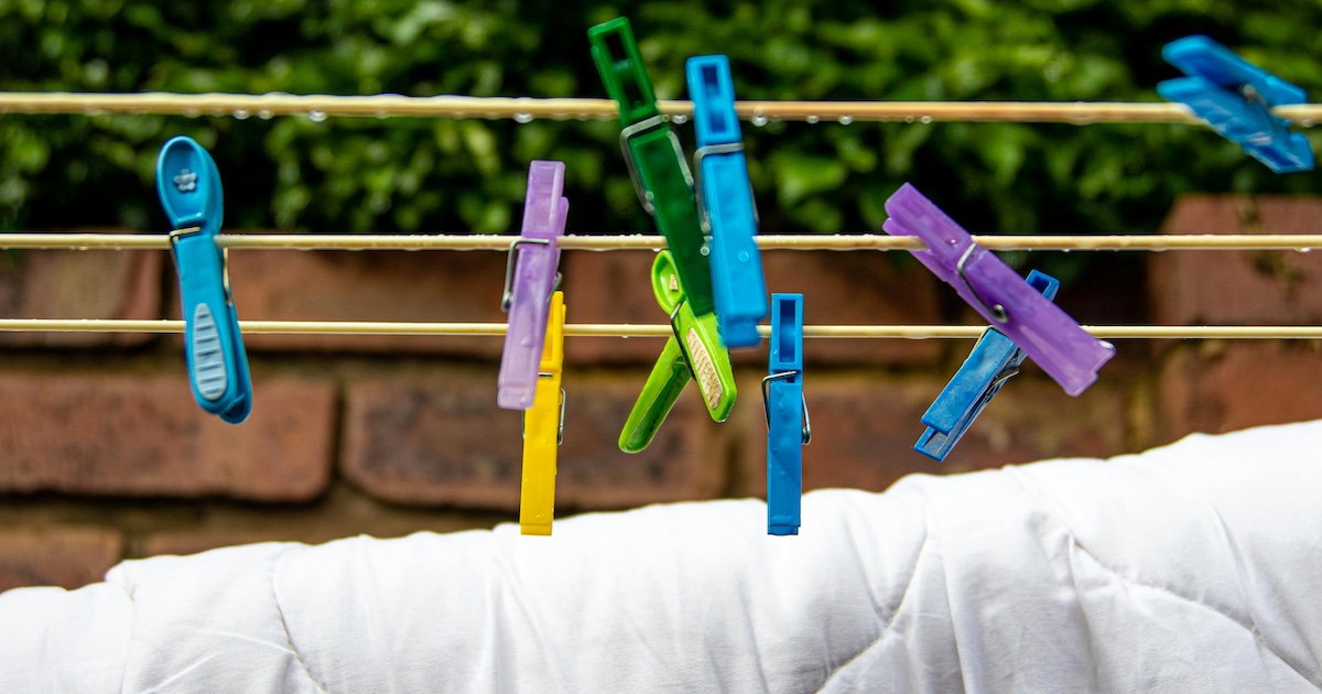 A duvet hanging on a washing line