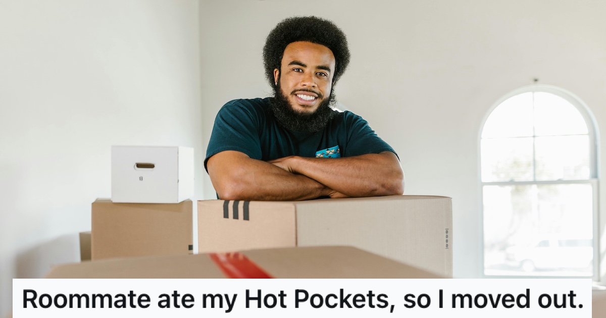 A smiling man with moving boxes