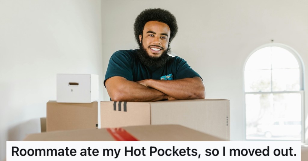 A smiling man with moving boxes