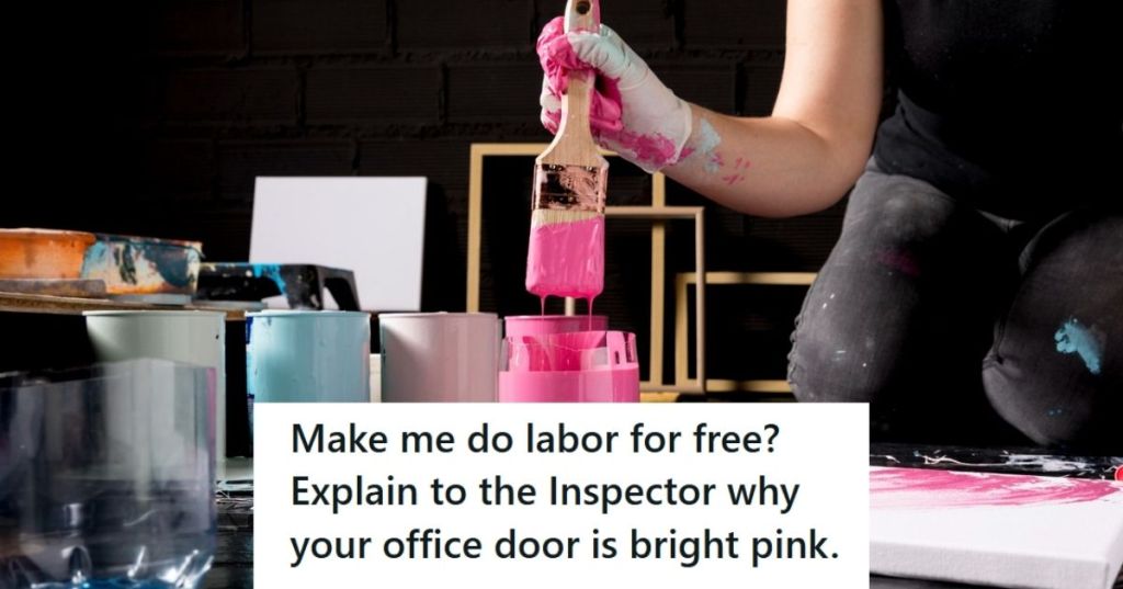 Artist holding paintbrush dipped in pink