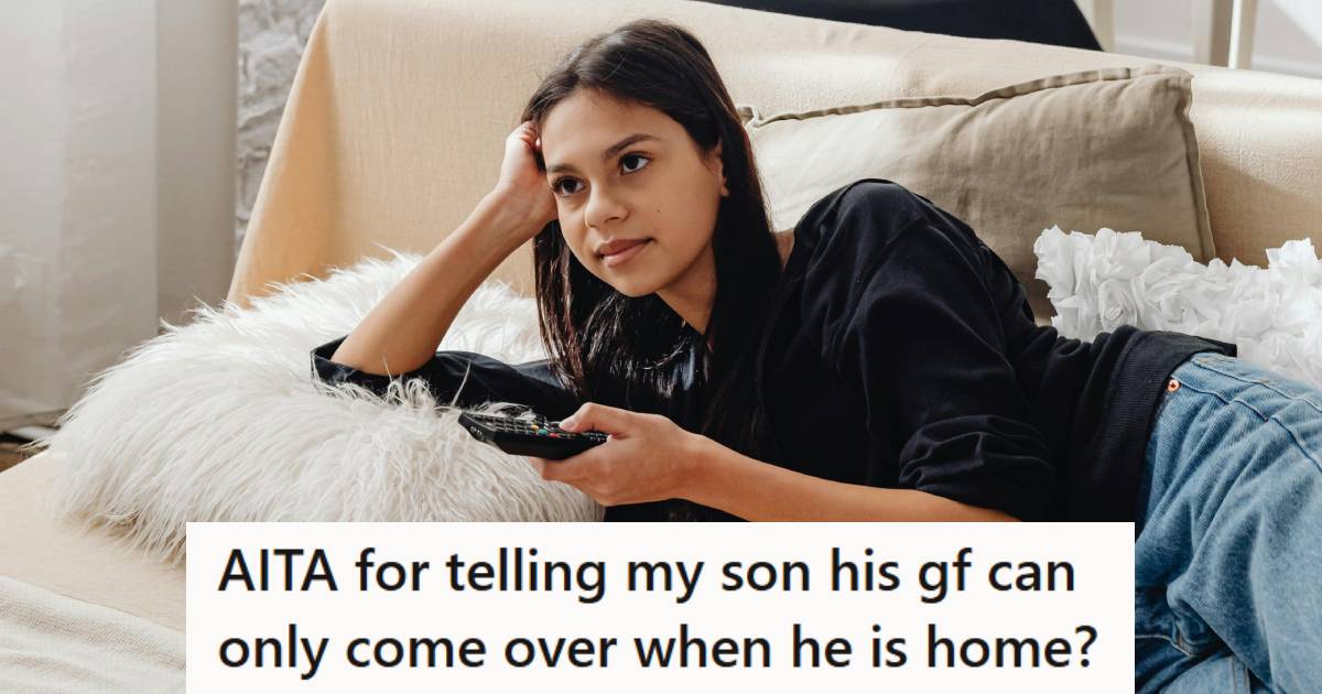 Girlfriend laying on the bed watching TV while her boyfriend isn't home