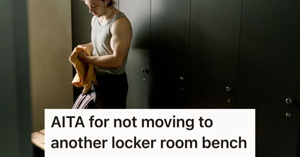 Man standing in front of a locker room bench