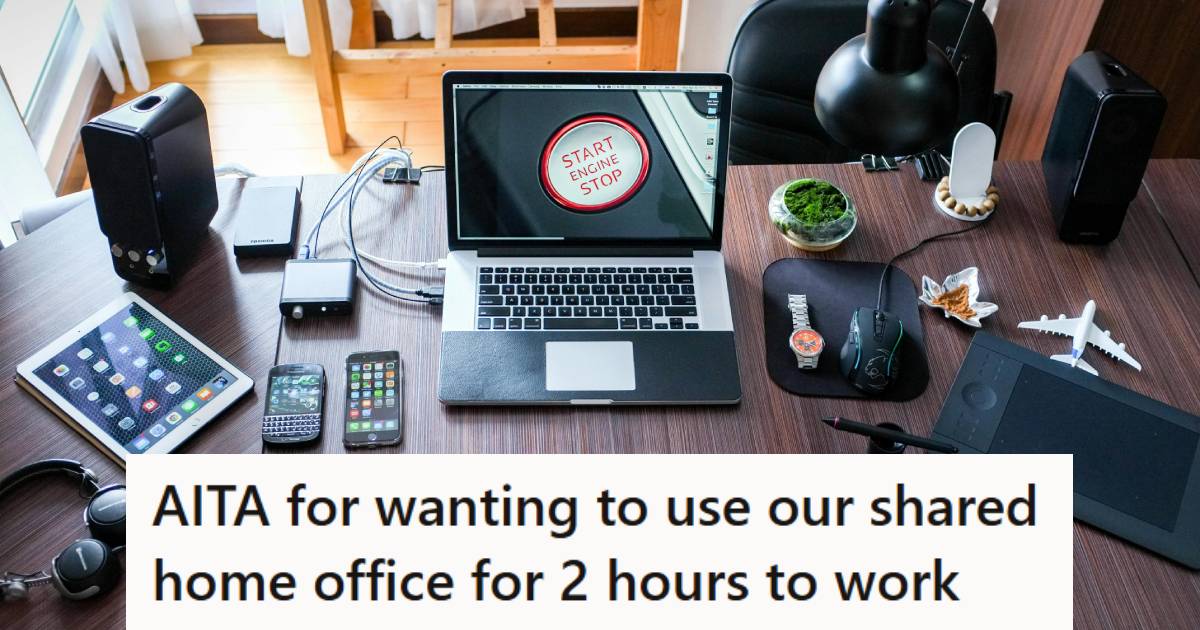 Laptop sitting on a u-shaped desk in a home office