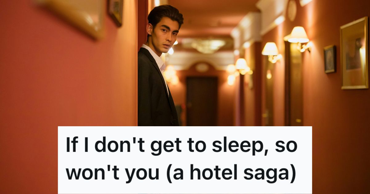 Young man hiding in a hotel corridor