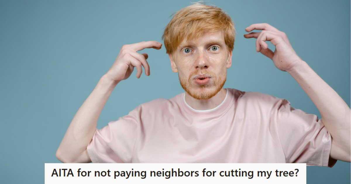 Man in pink shirt looking confused