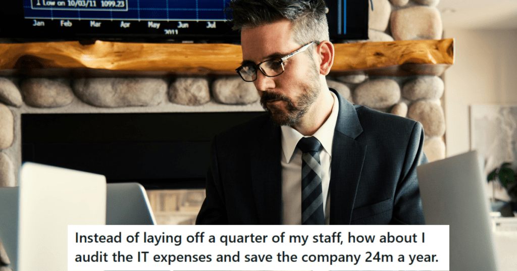 Man in black suit working on his laptop