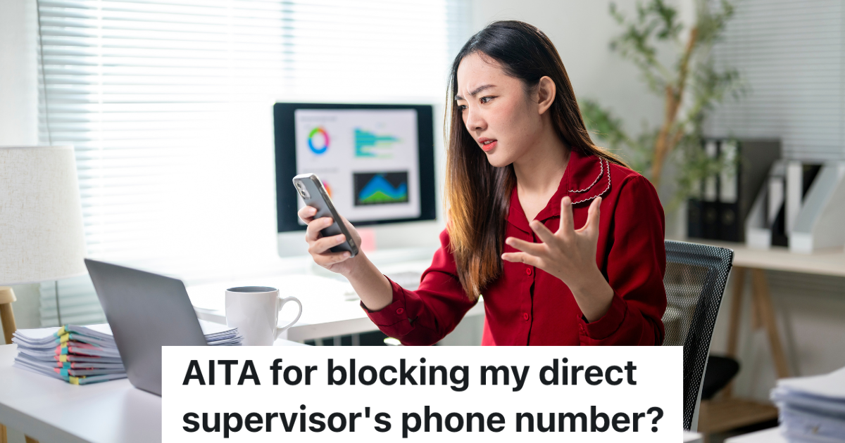 upset woman looking at her cell phone in an office