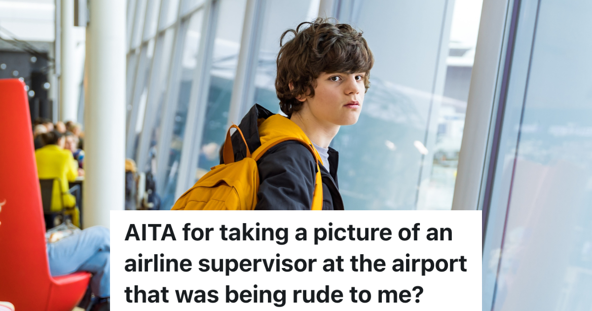 teenage boy standing near the windows of an airport