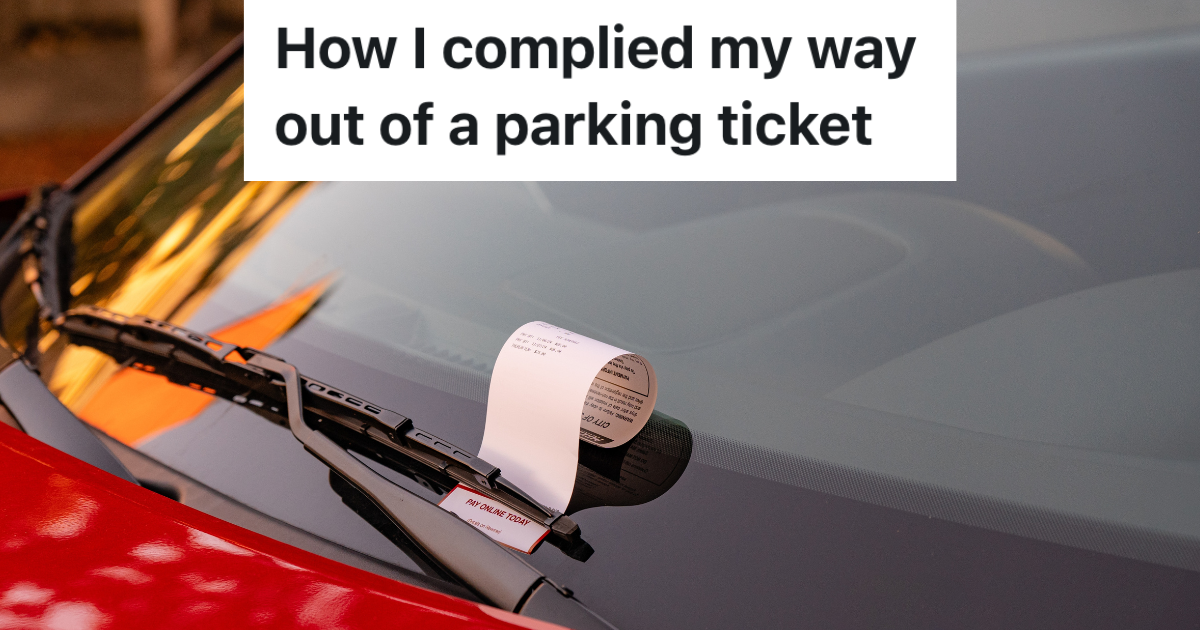 parking ticket on the windshield of a red car