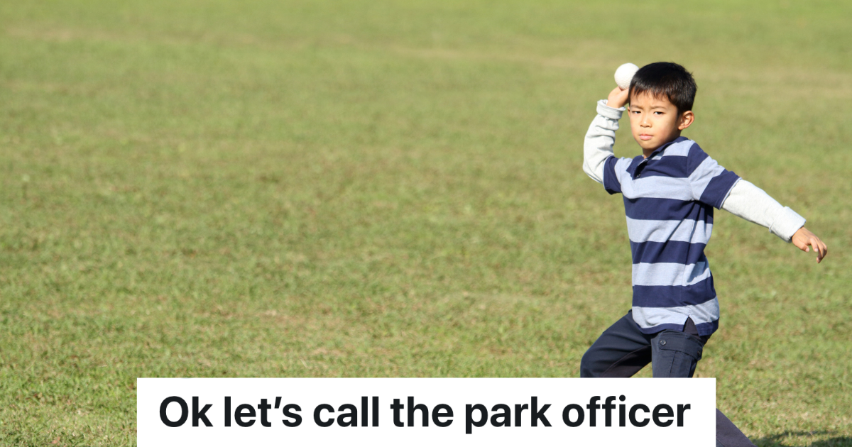 little boy ready to throw a baseball