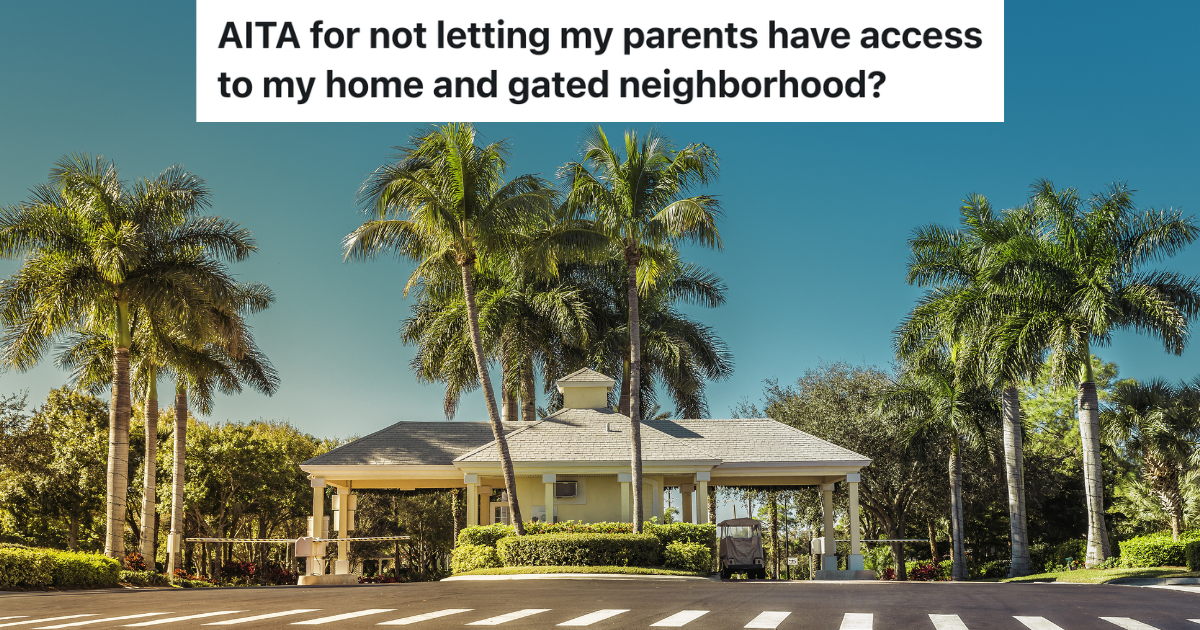 guard gate and palm trees at entrance to gated community