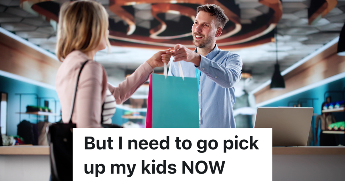 smiling man handing woman a shopping bag
