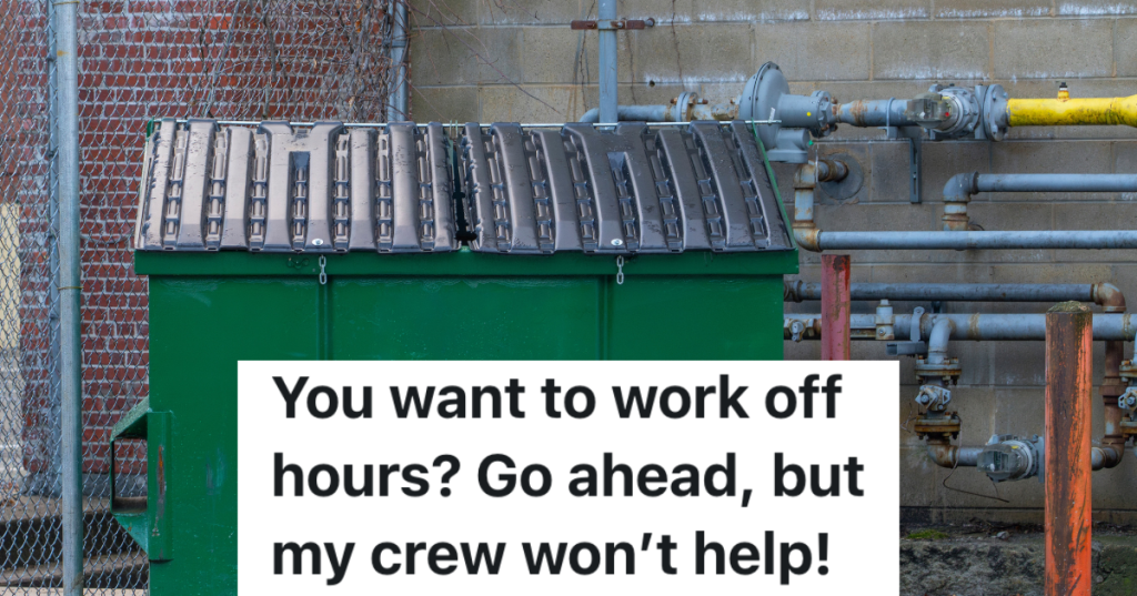 large green dumpster outside business