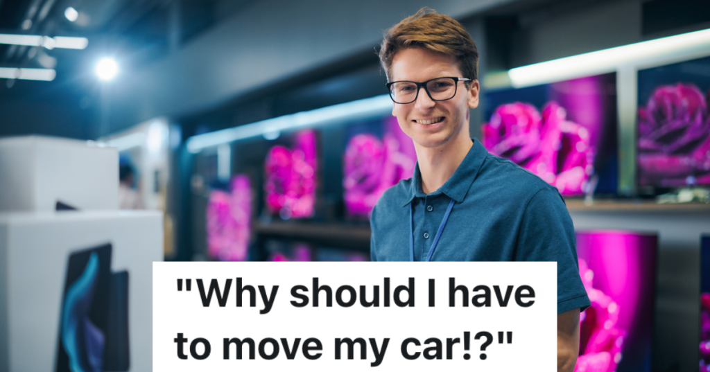 smiling man in glasses working at electronics store