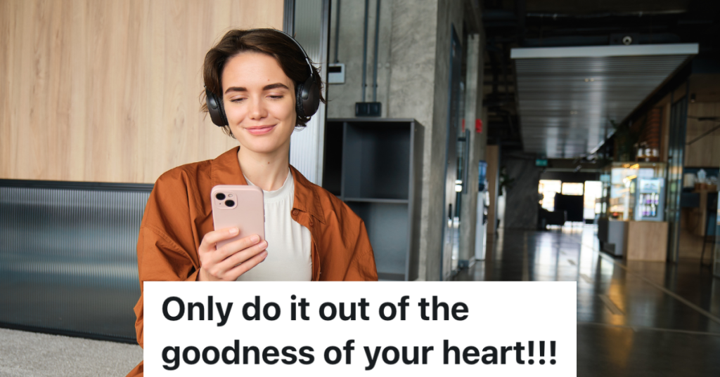 woman looking at phone and wearing headphones in office