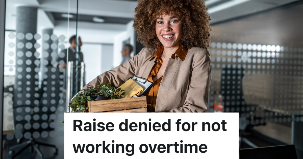 smiling business woman holding a crate of belongings